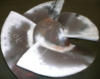 Repaired impeller blade undergoing magnetic particle inspection